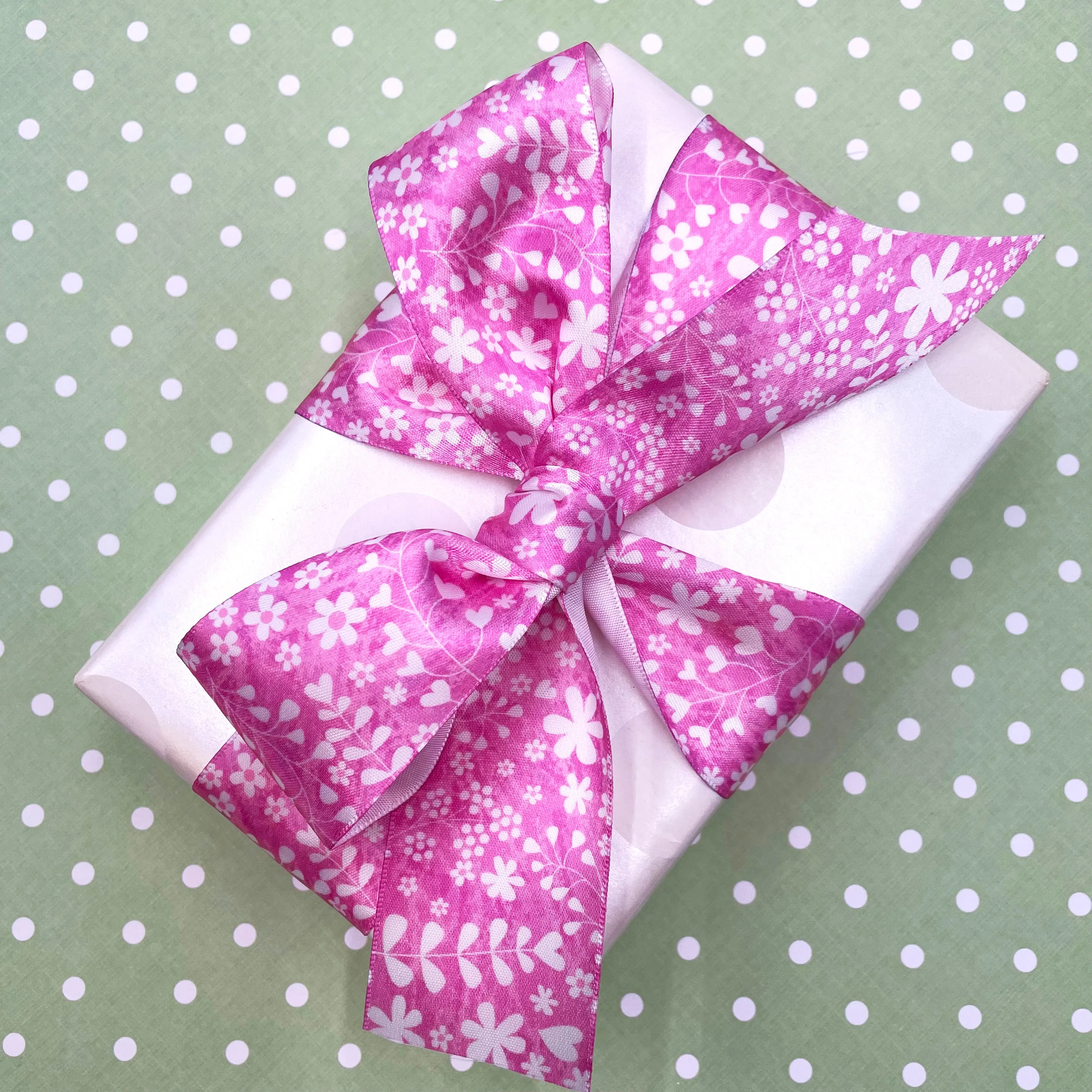 Spring floral print in white stencil on a lavender background printed on 1.5" white satin